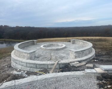 Country firepit project overlooking pond and country scene